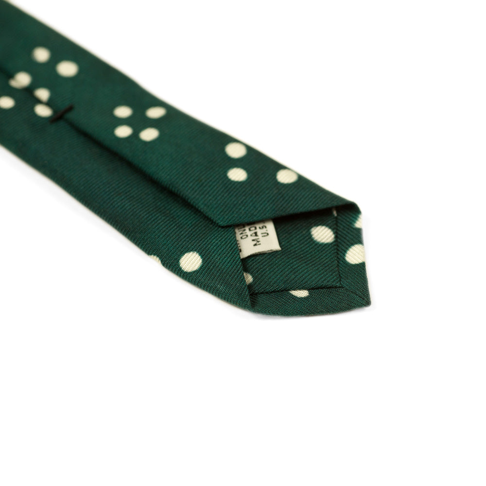 Green self-tipped silk tie, white Adire cross dot pattern