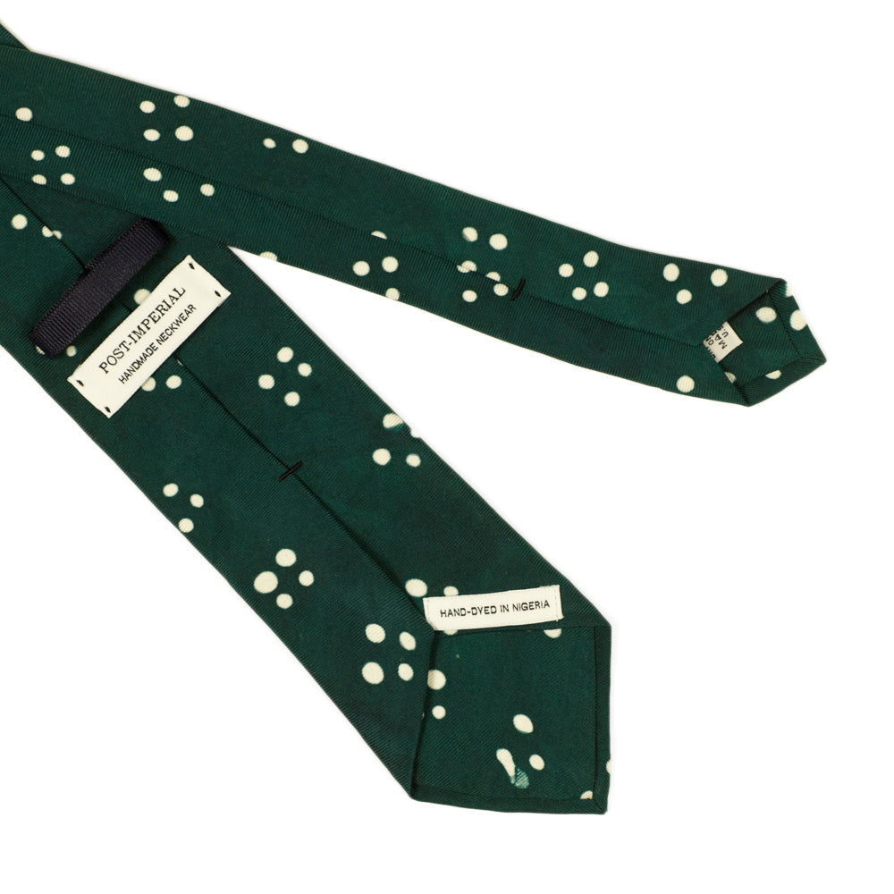 Green self-tipped silk tie, white Adire cross dot pattern