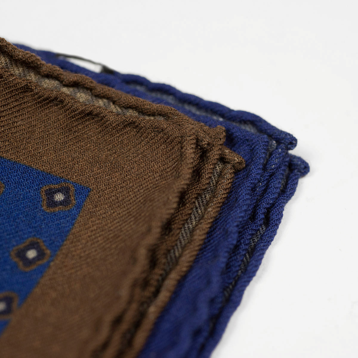 Double-faced wool pocket square, blue, brown & cream neat print