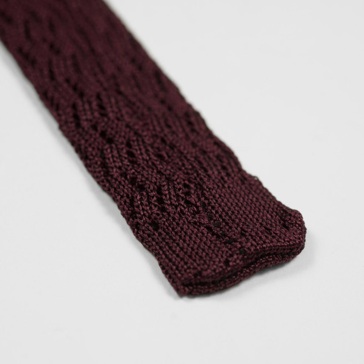 Burgundy square bottom silk knit tie, zig-zag weave