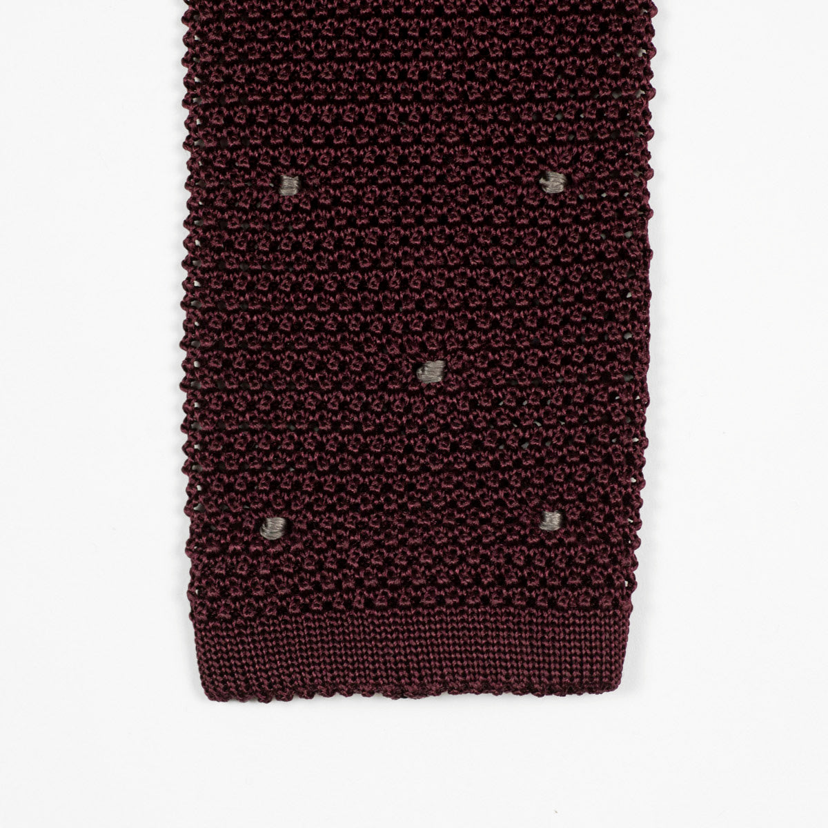 Burgundy square bottom silk knit tie, hand-sewn grey dots