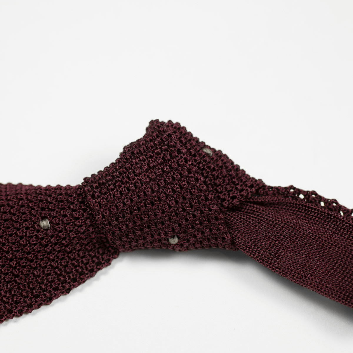 Burgundy square bottom silk knit tie, hand-sewn grey dots