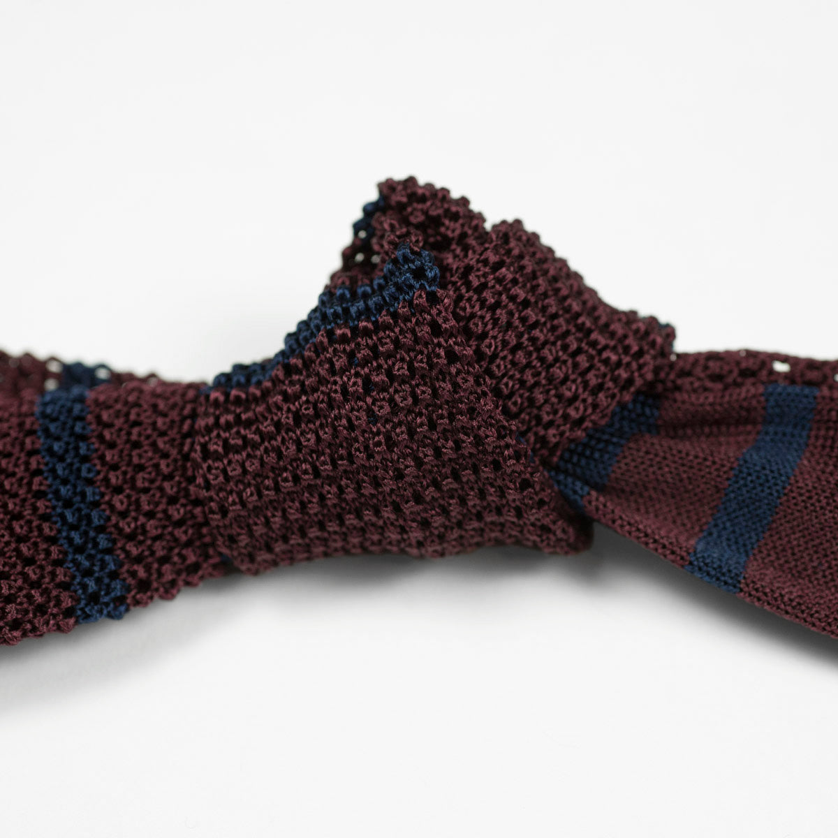 Burgundy square bottom silk knit tie, navy stripes