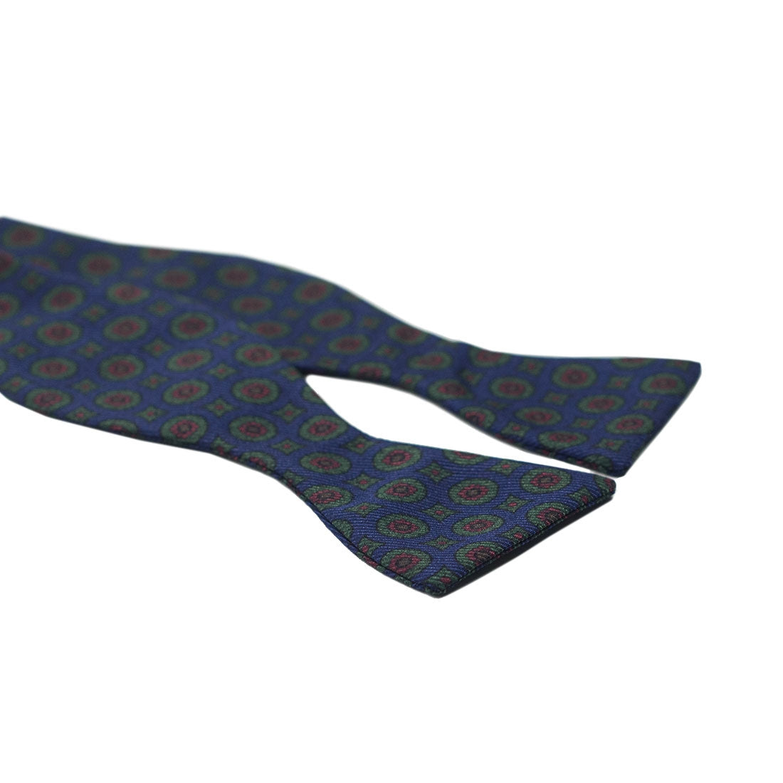 Blue silk bow tie with green & rust neat print