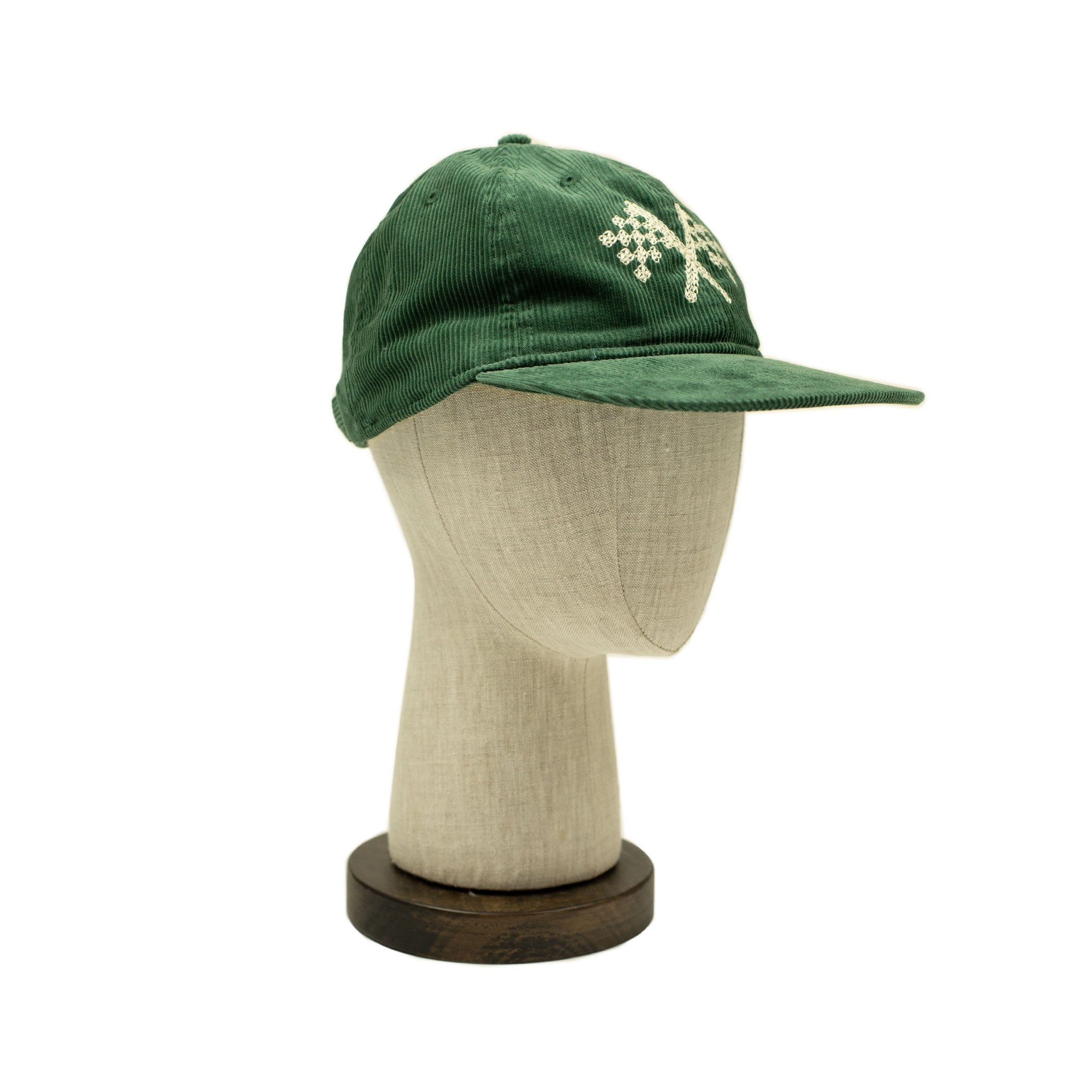 Corduroy cap in green with racing flag chainstitched embroidery