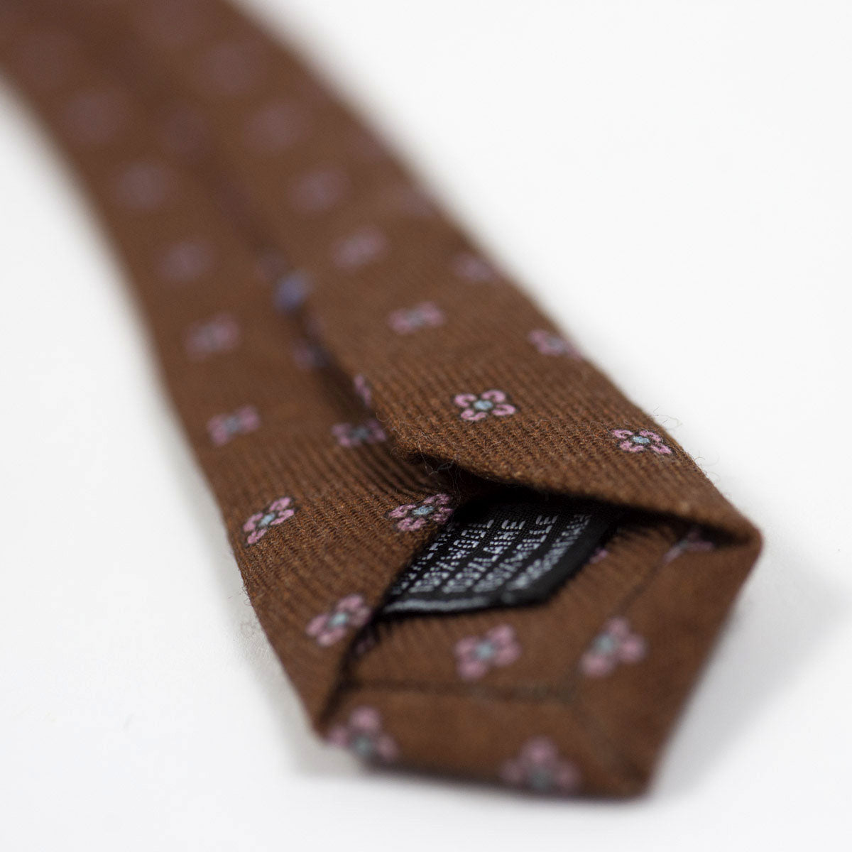 Brown self-tipped wool tie, pink neat print