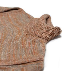 Rollneck sweater in sunset rust, taupe and white wool mix