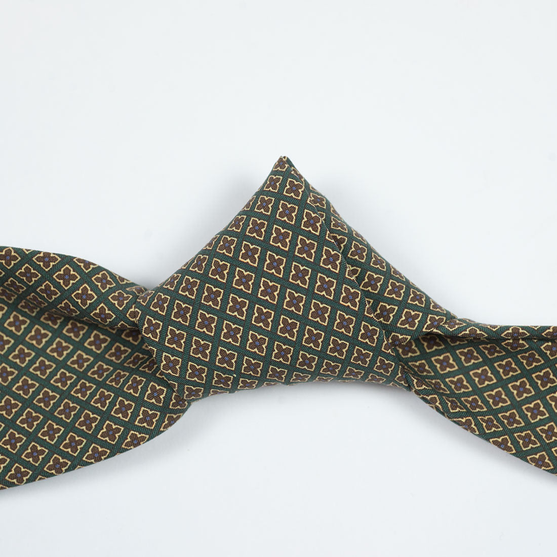 Dark green silk tie with brown neat print