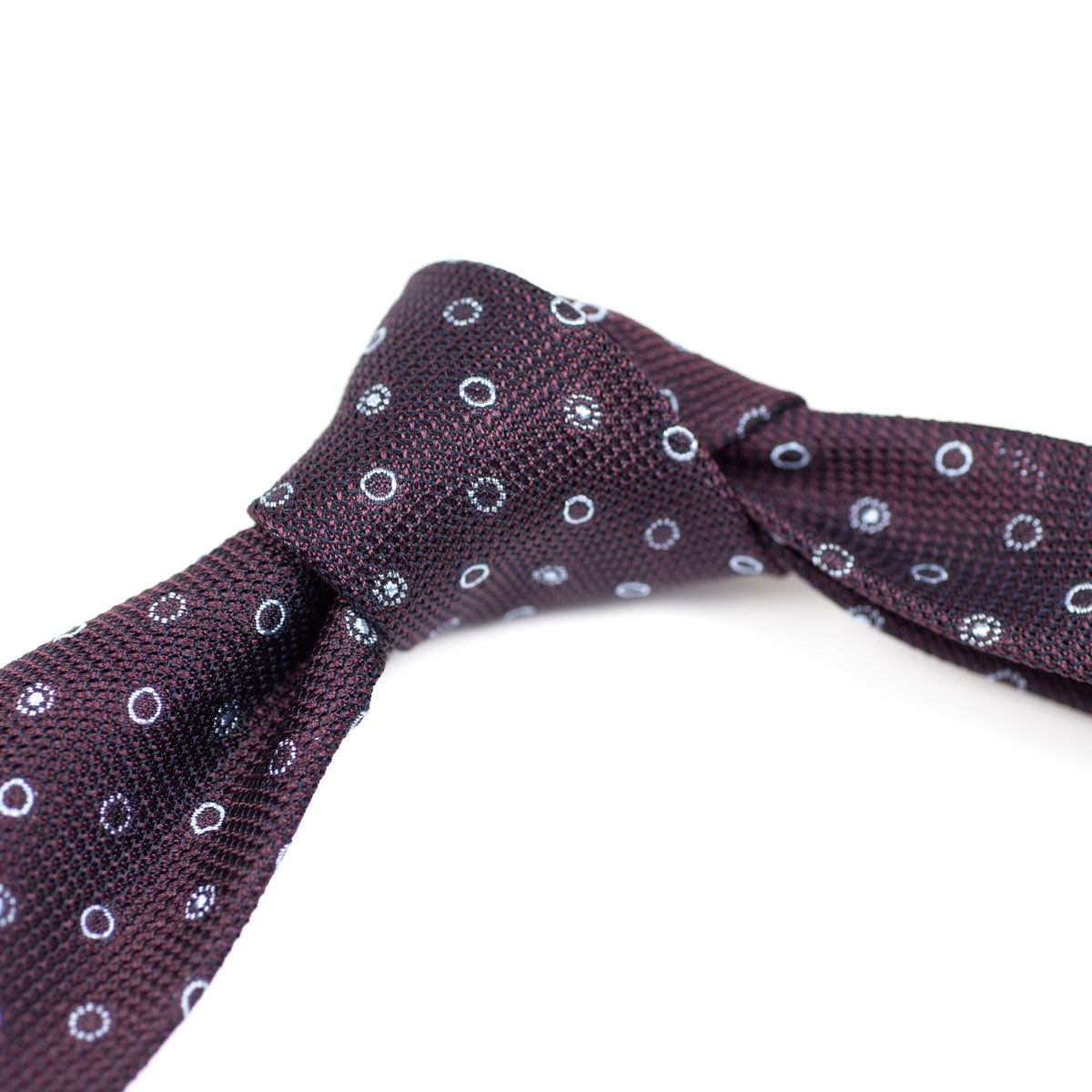 Burgundy woven silk tie, light blue circular motifs