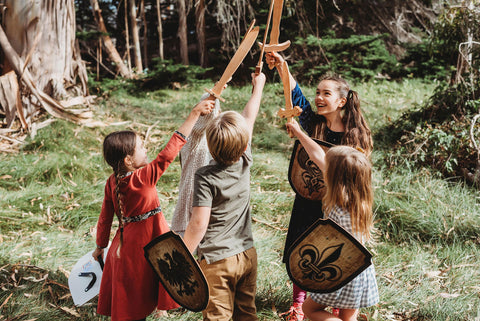 Children playing with wooden swords