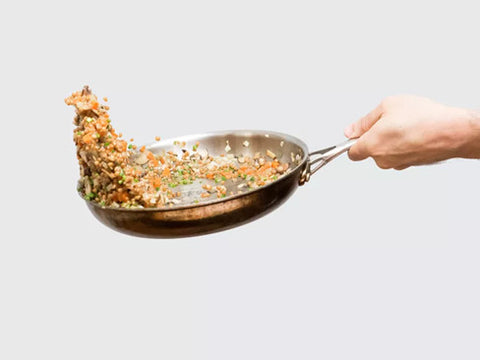 Toss food into the pan