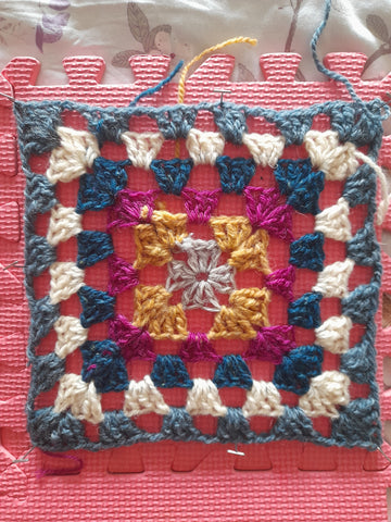 A pinned out, blocked granny square