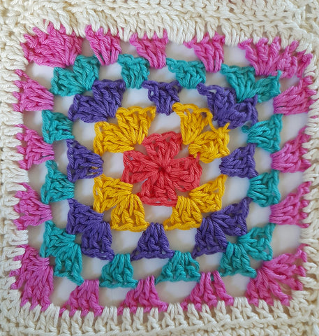 Close up of a multi colour granny square 