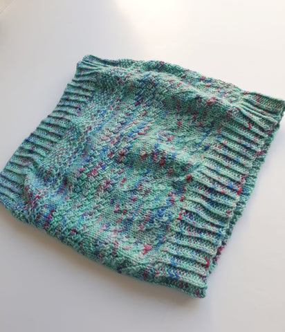 Hand knitted cowl in hand dyed yarn (variegated green with raspberry speckles)