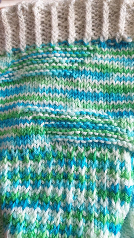 back of a hand knitted sock in Valgaudemar pattern, using slanted purl rows