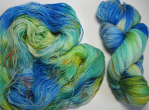 hand dyed yarn in blue, green and speckled colourway