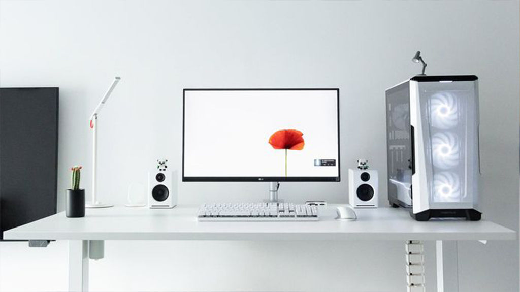 Sleek white desk with ergonomic chair for a productive workspace in Singapore.