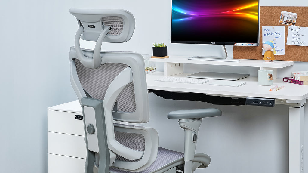 Contemporary office desk with ergonomic chair and clean setup in Singapore.