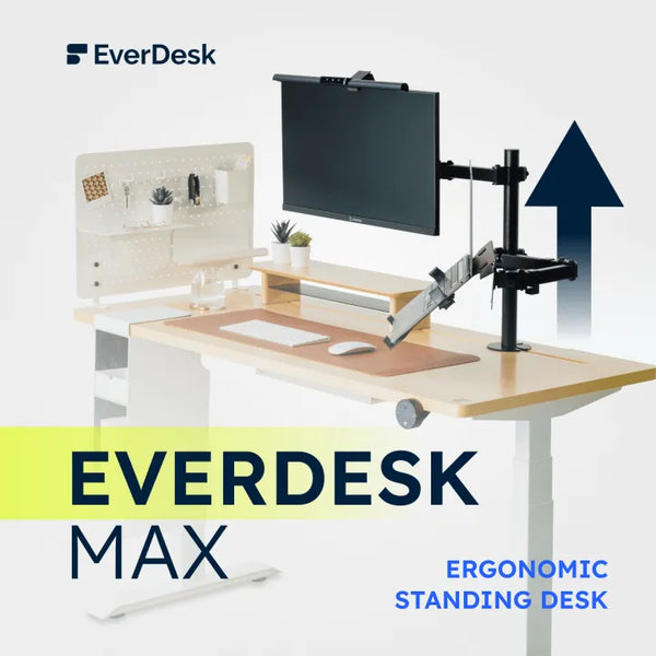 Everdesk Max Ergonomic Standing Desk - A modern and sophisticated standing desk setup by Everdesk, featuring a monitor mounted on an adjustable arm, a whiteboard with stationery organizers, and minimal desk accessories. The workspace is designed to promote productivity and comfort, with a focus on ergonomics, exemplified by the sleek design and clean lines.