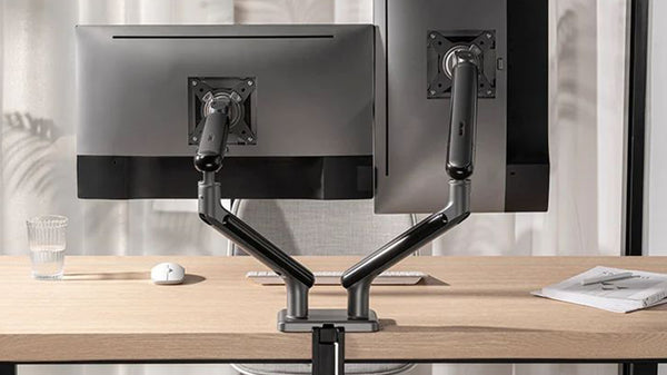 Modern ergonomic workspace with multiple monitor arms maximizing efficiency in Singapore.