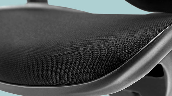 Close-up of Flujo's ergonomic chair seat mesh fabric designed for breathability and comfort in Singapore.