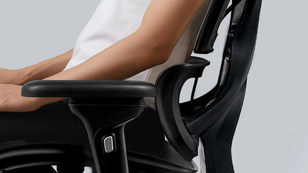 Side view of Flujo ergonomic office chair highlighting the adjustable armrest for personalized comfort in Singapore.