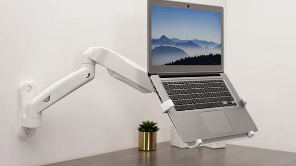 Laptop on ergonomic mount for adjustable workstations in Singapore.