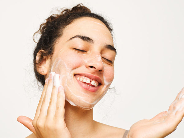 Woman washing face