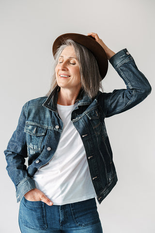 Silver-woman-denim-jacket-and-jeans-white-tshirt-wearing-hat-smiling