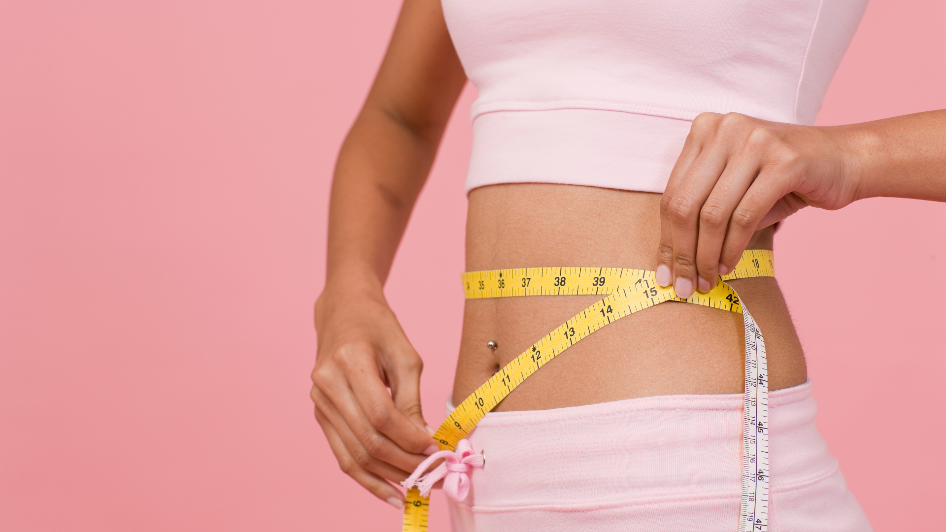 Woman measuring her hips