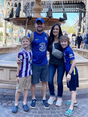 The Bold Bow Tie Founder & CEO Kristyn Mason with her husband and two sons at EPCOT at Walt Disney World