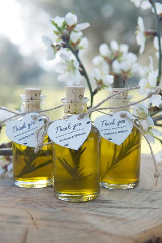 Olive oil party favors with rosemary for a European themed olive green wedding