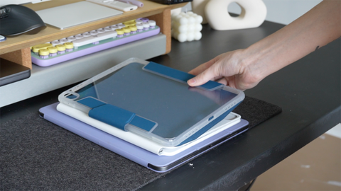 image of laying down an iPad case on top of a stack of iPad cases