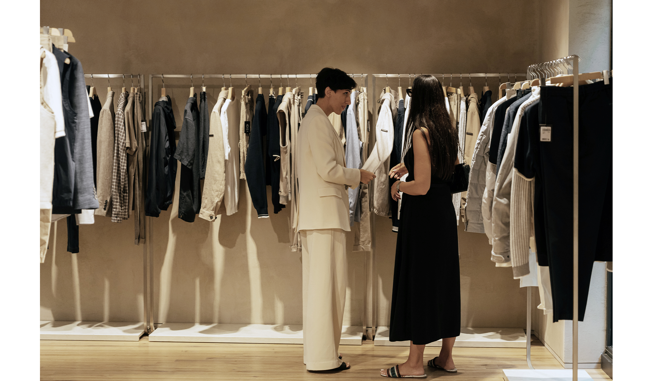 People talking at the Peserico store in Milan via della Spiga