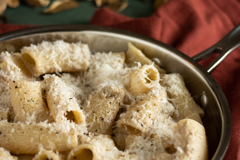 Serve and garnish paccheri pasta