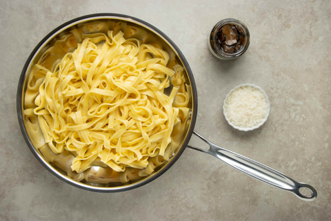 Drain pasta and bring back to pot