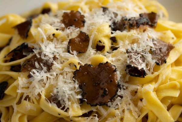 Black truffle tagliatelle pasta with parmigiano reggiano cheese