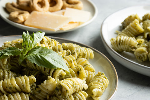 Serve and enjoy a traditional italian pesto meal