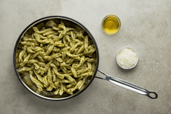 Mix pesto sauce and pasta together