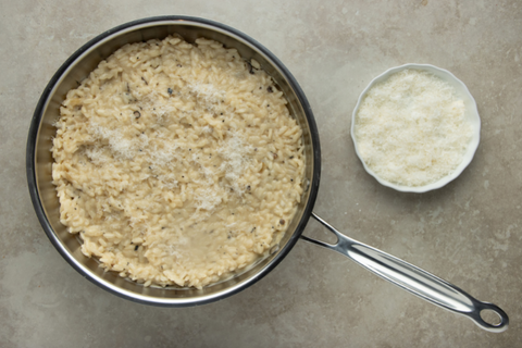 Add salt and parmigiano cheese to the truffle risotto mix
