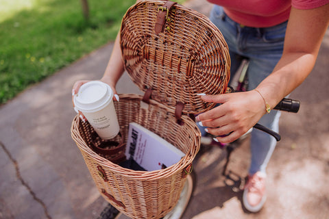 picnic basket on bicycle with coffee and a book