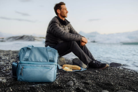 man eating lunch on Diamond Beach in Iceland