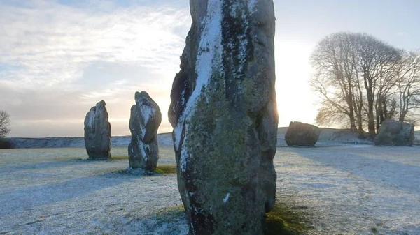 The winter scene showcases the standing stones of Henge, inspired by the Landscape Exhibition in Avebury, Marlborough, Wiltshire.
