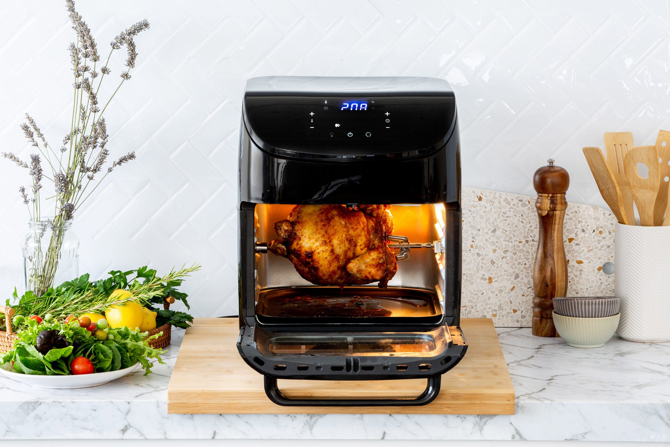 Chicken roasting inside the AF1230 air fryer