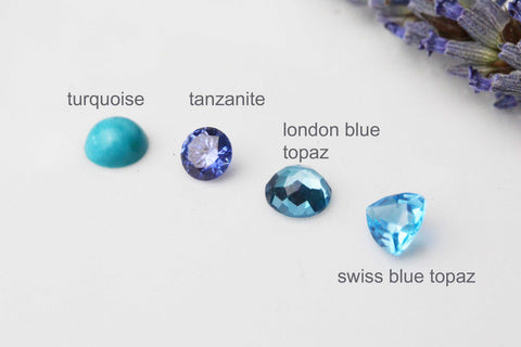december birthtones line up turquoise, tanzanite, london blue topaz and sky blue topaz