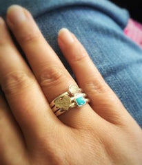 gold heart stacking ring set on finger