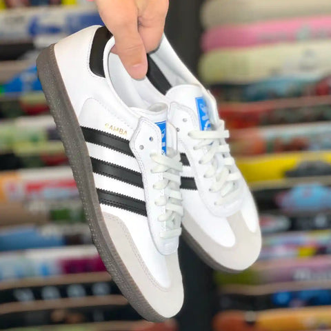 Adidas Skateshoe In Front Of Skateboard Decks