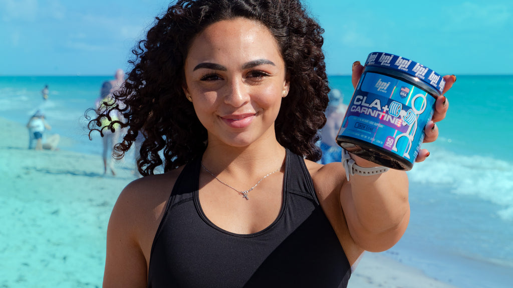 Girl holding a bottle of CLA+Carnitine