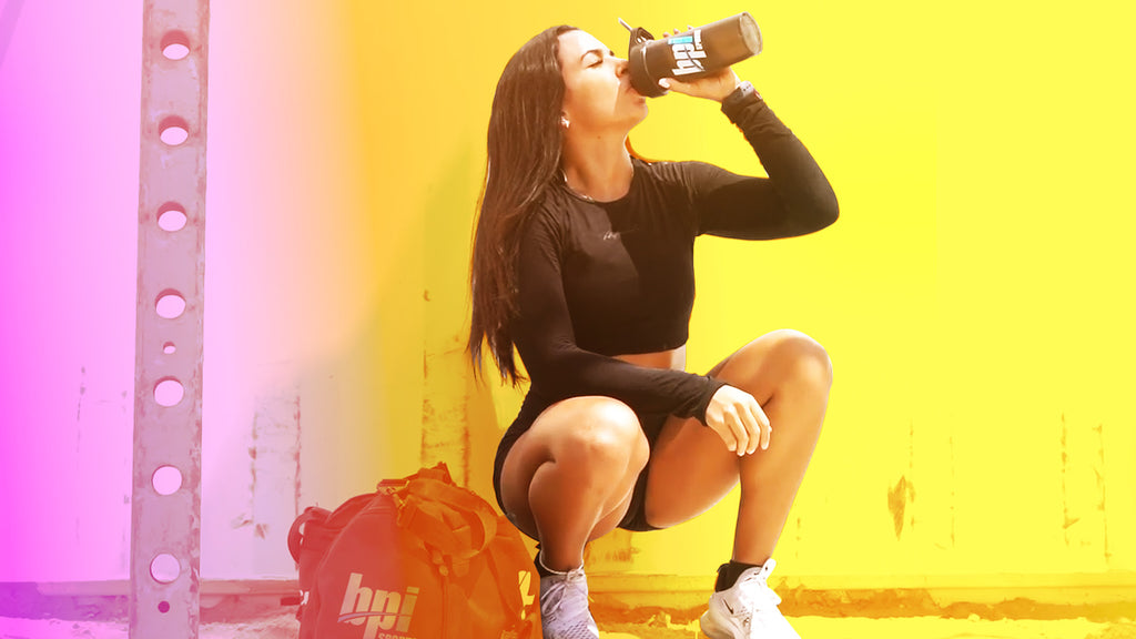 fitness girl drinking shaker cup