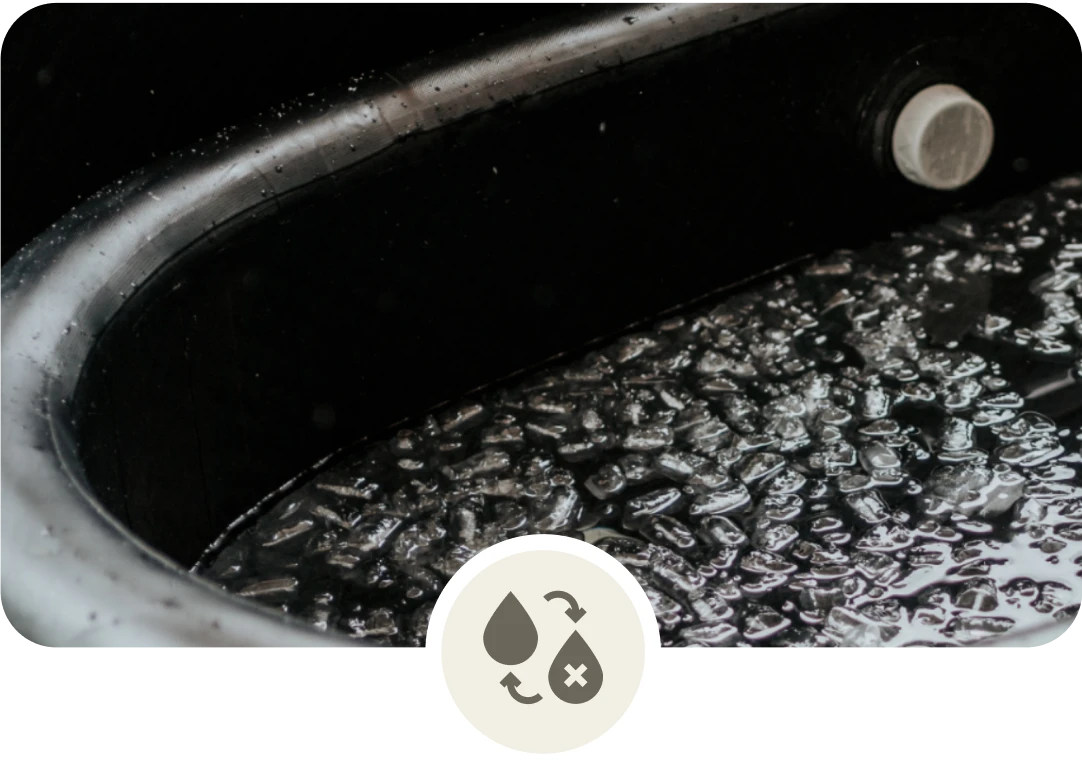 Close-up of ice cubes in a black container.